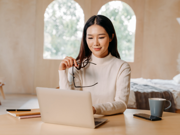 A business professional working on a laptop — researching the best commercial insurance in Ontario.
