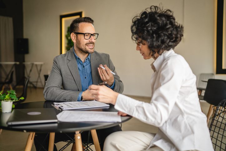 A professional broker discussing how to build coverage with the future in mind.